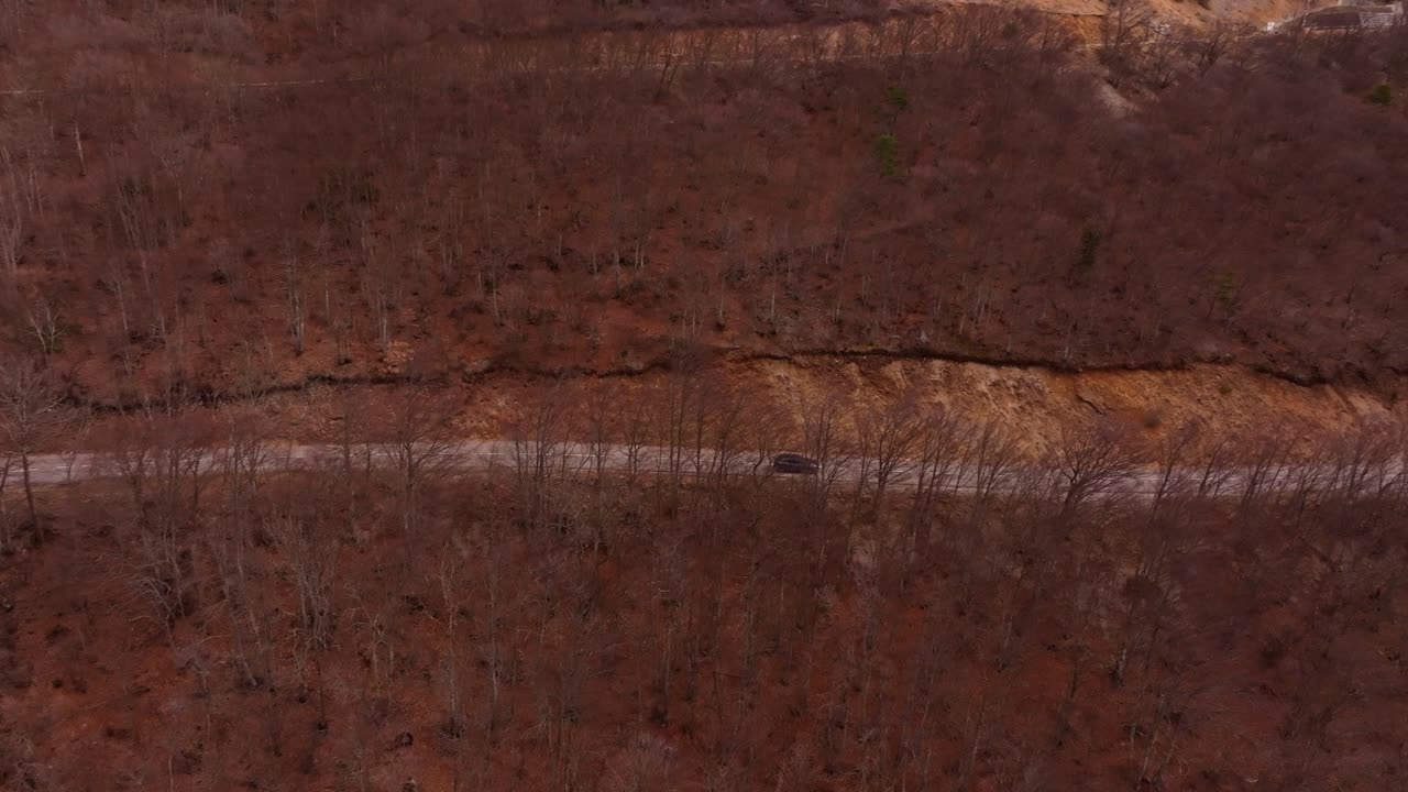Aerial view of cars navigating French alpine route