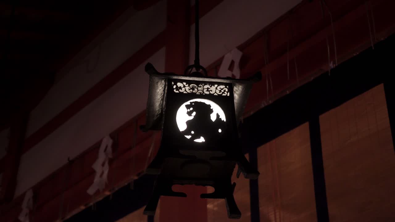 A Symbolic Decorative Lantern Inside The Fushimi Inari-Taisha Temple In Japan - Medium Shot