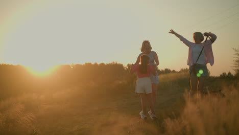 happy family joyfully jumping and playing outdoors at dawn in warm golden sunlight, in grassy countryside, one family member holds leash with dog as they leap in celebration