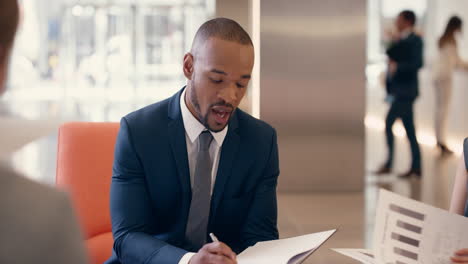 multi-ethnic business people working in business lobby