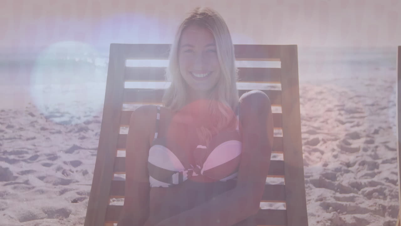 Relaxing on beach chair under bright sunlight, woman smiling and enjoying animation