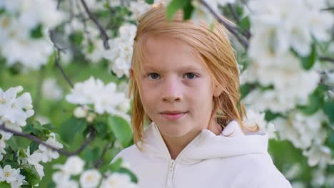 girl in an apple blossom tree