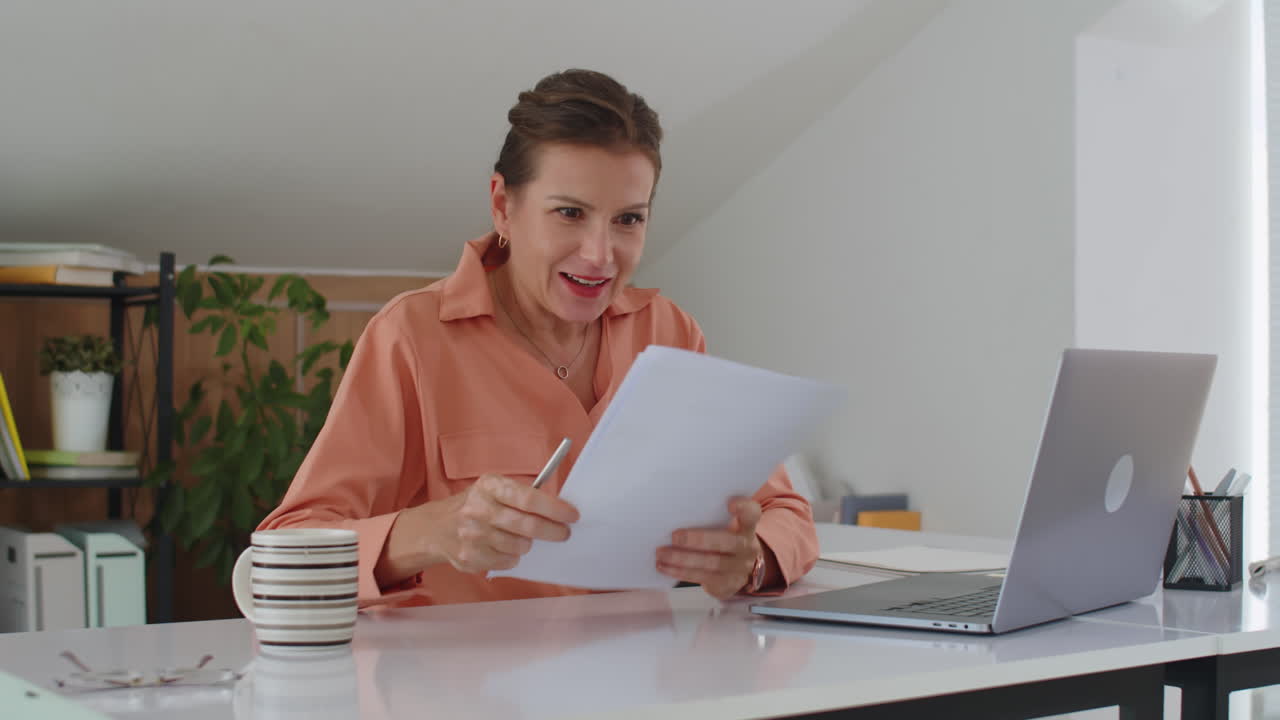 Happy Woman Rejoicing at Job Promotion at Office