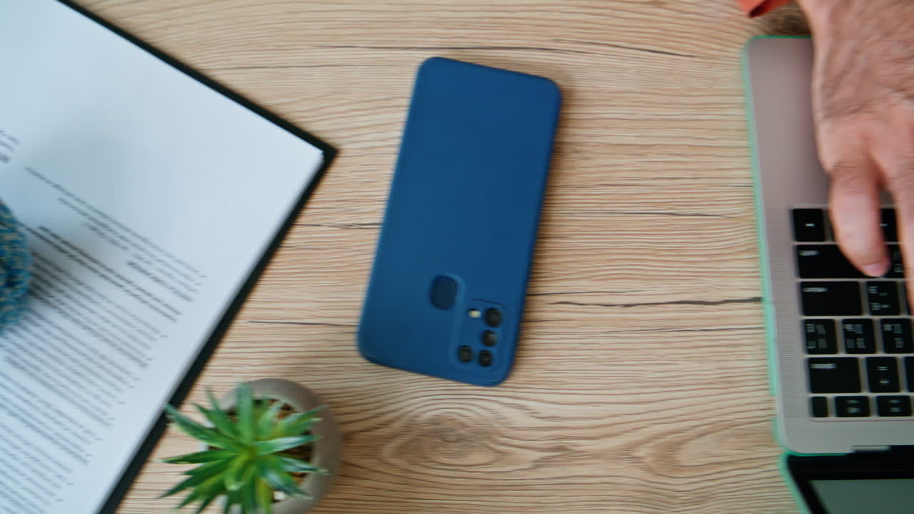 Student hands typing text on laptop at desk closeup. Unknown freelancer working