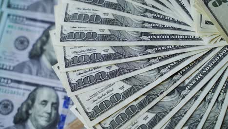 fan of hundred dollar bills