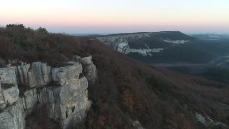 mountain cliff landscape at sunrise/sunset