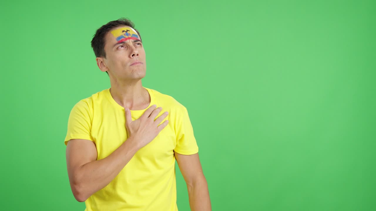 Man listening to the Ecuador national anthem with solemnity