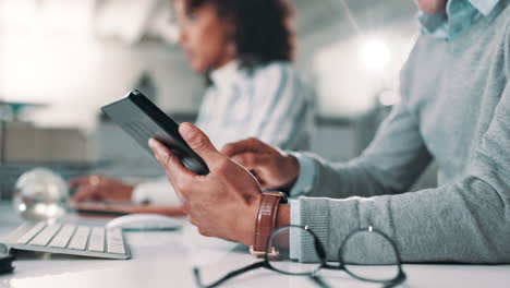 people working in an office using technology