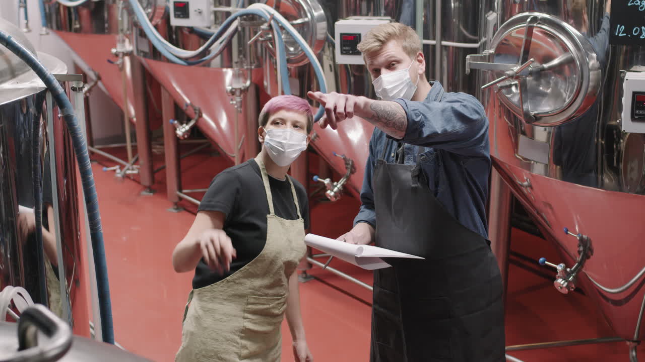 Brewery Workers At Beer Production Factory