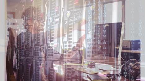 binary code and data servers over person working at computer in office