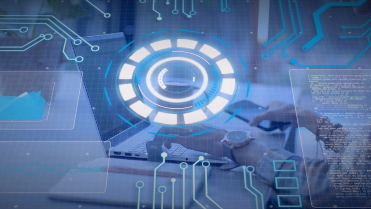 Male tech worker typing at laptop, reaching phone, tapping, syncing with HUD animating over devices