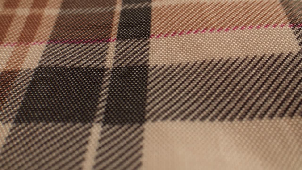 Macro View of Brown and Beige Plaid Fabric Texture