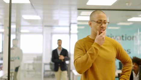 man collects his belongings from an office after being fired