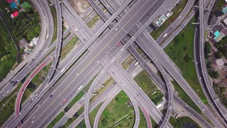 4k drone footage top view of highway road junctions. the intersecting freeway road overpass the eastern outer ring road of bangkok, thailand.