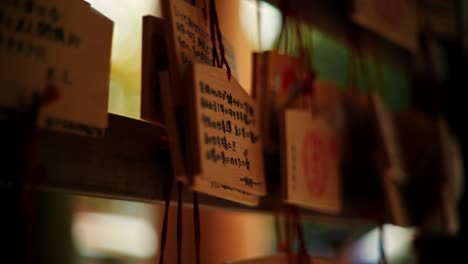 wooden plaques with prayers at a shrine