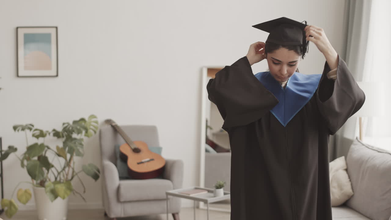 Female Graduate and Her Father on Online Graduation Ceremony