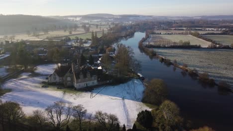 aerial footage over river thames on a snowy, wintery morning