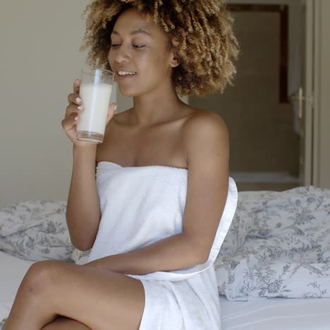 Pretty-Girl-Drinking-Milk-On-The-Bed