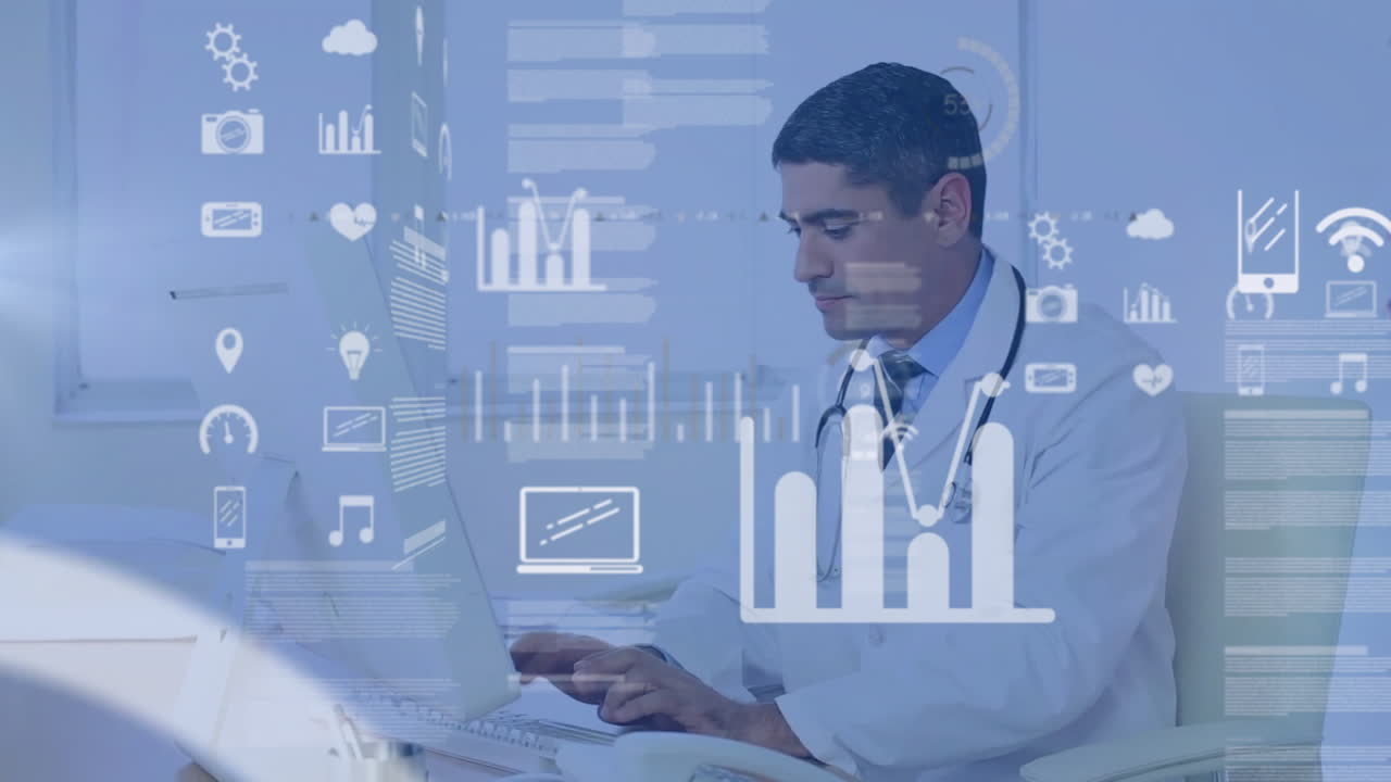 Male doctor sitting at desk typing on laptop in medical office, showcasing floating health charts