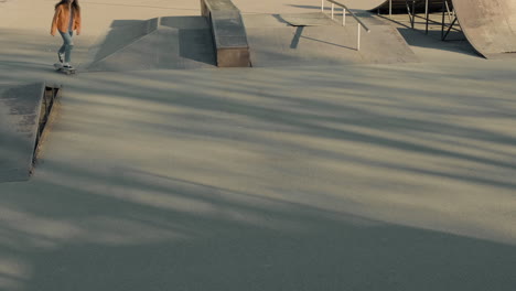 young skater girl entering in a skate park 2