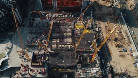 cranes and equipment at office center construction site