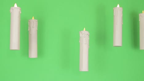 floating candles with green backdrop . green screen