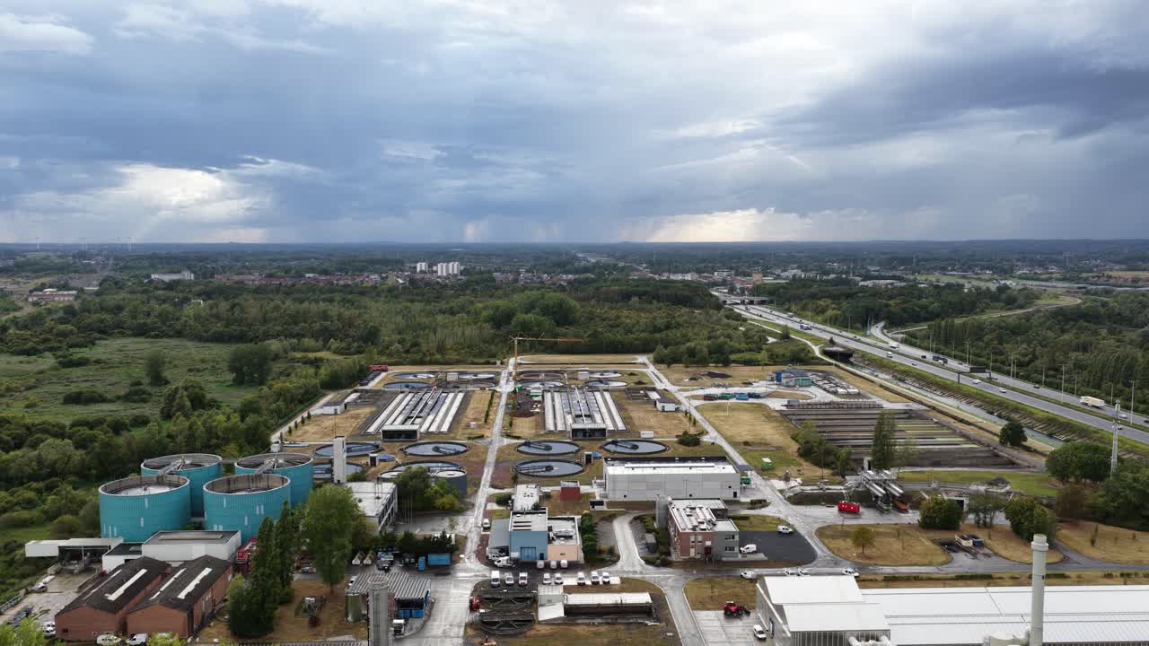 Sewage treatment plant in Quaregon, Belgium. Aerial drone view of facility overview at daytime. Cleaning and purifying water for drinking and consumption