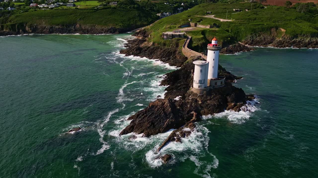 Panoramic panning drone movement near the coastal Petit Minou lighthouse twin towers, Plouzané, Finistère, Brittany, France