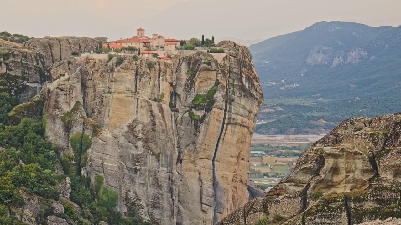 Meteora vertical cliffs Rock formations and Greek monastery