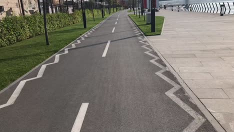 Raw-footage-of-frontal-view-of-bike-lane-during-bike-ride-in-city