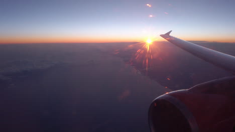 sun rise or sun set over coast line from the airplane