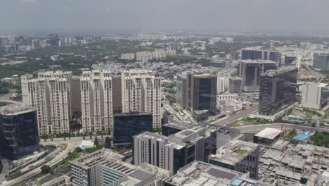 aerial footage a cinematic video of a developed city shows skyscrapers, main roads, and bridges