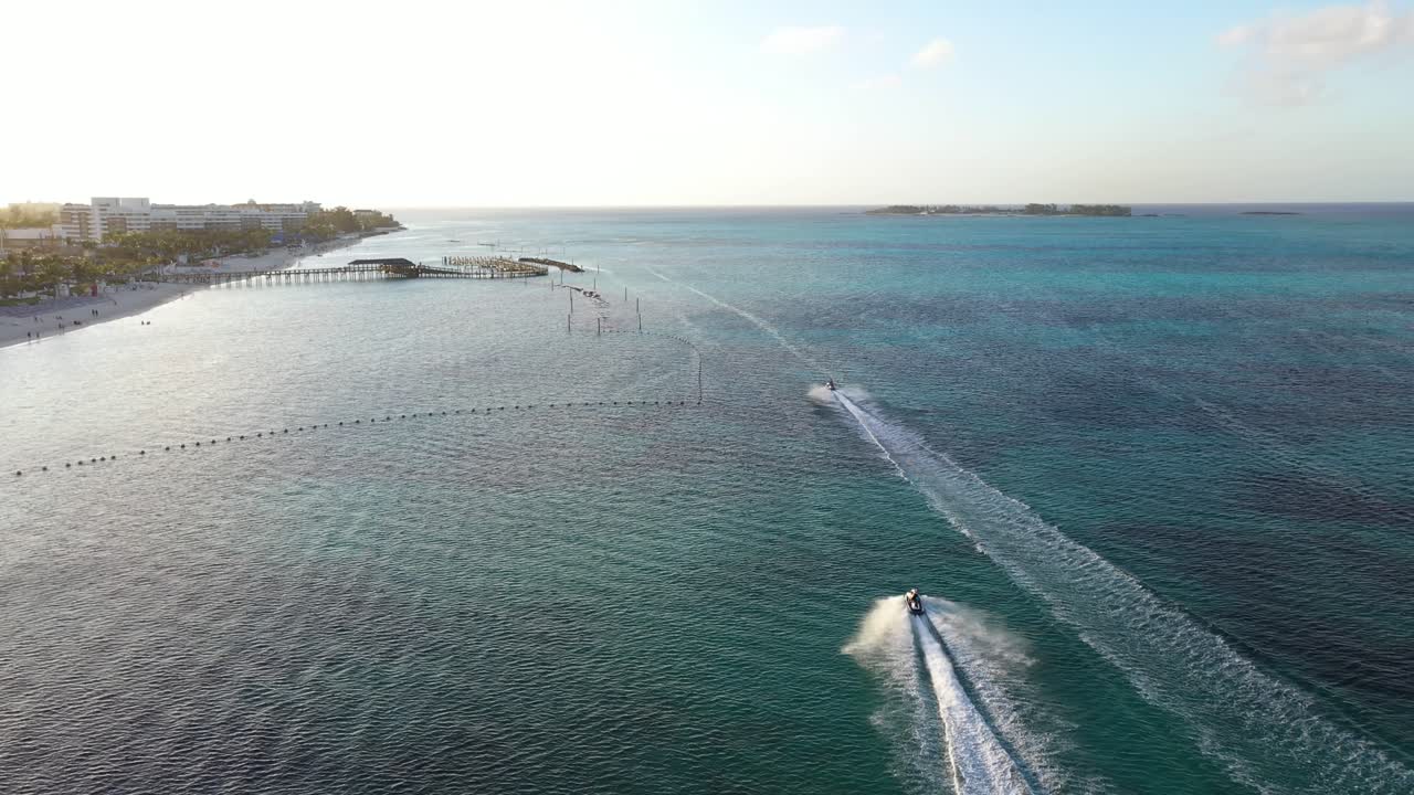 Drone Aerial View of Jet Skis by Exotic Bahamas Beach and Pier, Nassau