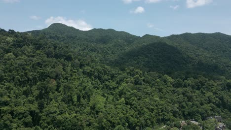 aerial scenic nature drone footage of the mountains and beaches on the tropical island of koh chang in thailand on a sunny day