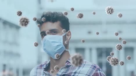 animation of covid 19 virus cells over man wearing face mask