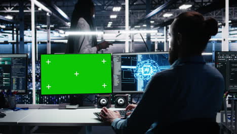 server room technician using ai on green screen pc