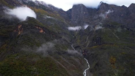 Steam-rises-on-slopes-of-mountain-after-rain,-creeks-flows-down-through-valleys-in-Alps-of-Albania