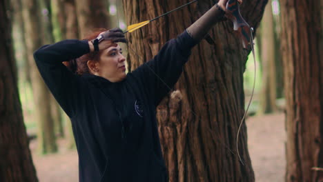 archery-woman-pulls-and-shoots-arrow-super-slow-motion-long-shot