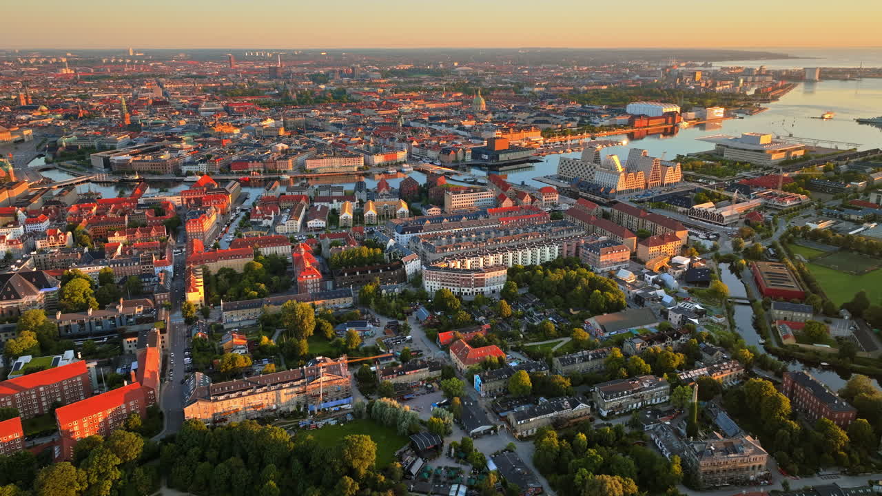 Aerial drone view of the city centre of Copenhagen, Denmark at sunset