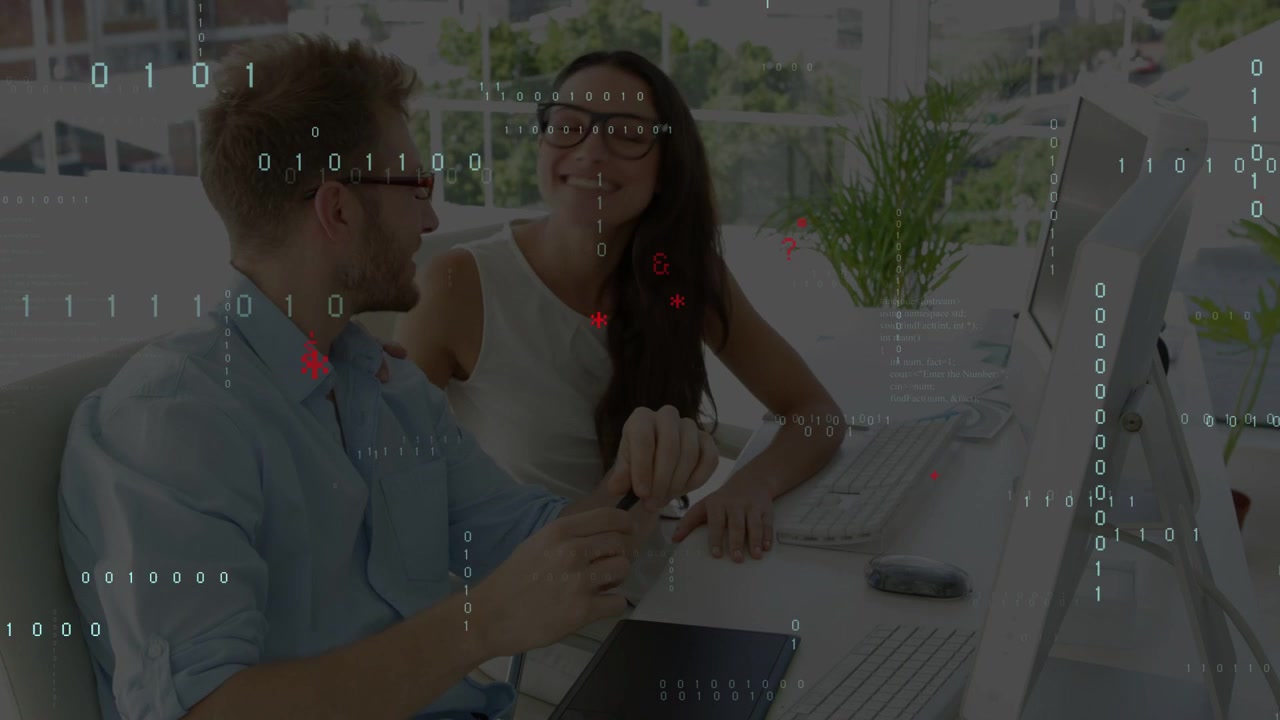 Man using stylus and woman pointing at monitor, tapping mouse initiating code overlay for review