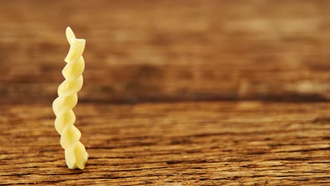 Gemelli-pasta-on-wooden-table