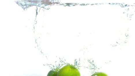 Lime-falling-into-water-in-super-slow-motion