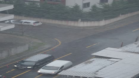 snowy/rainy city street intersection