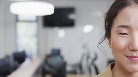 portrait of happy asian businesswoman in office, slow motion