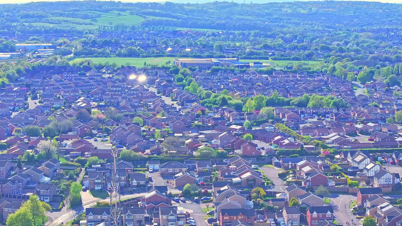 Aerial: residential area during the day in Rother Valley Country Park in the Metropolitan Borough of Rotherham, South Yorkshire, England, crane up drone shot