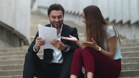 People-looking-at-good-results-on-documents.-Colleagues-showing-yes-gesture