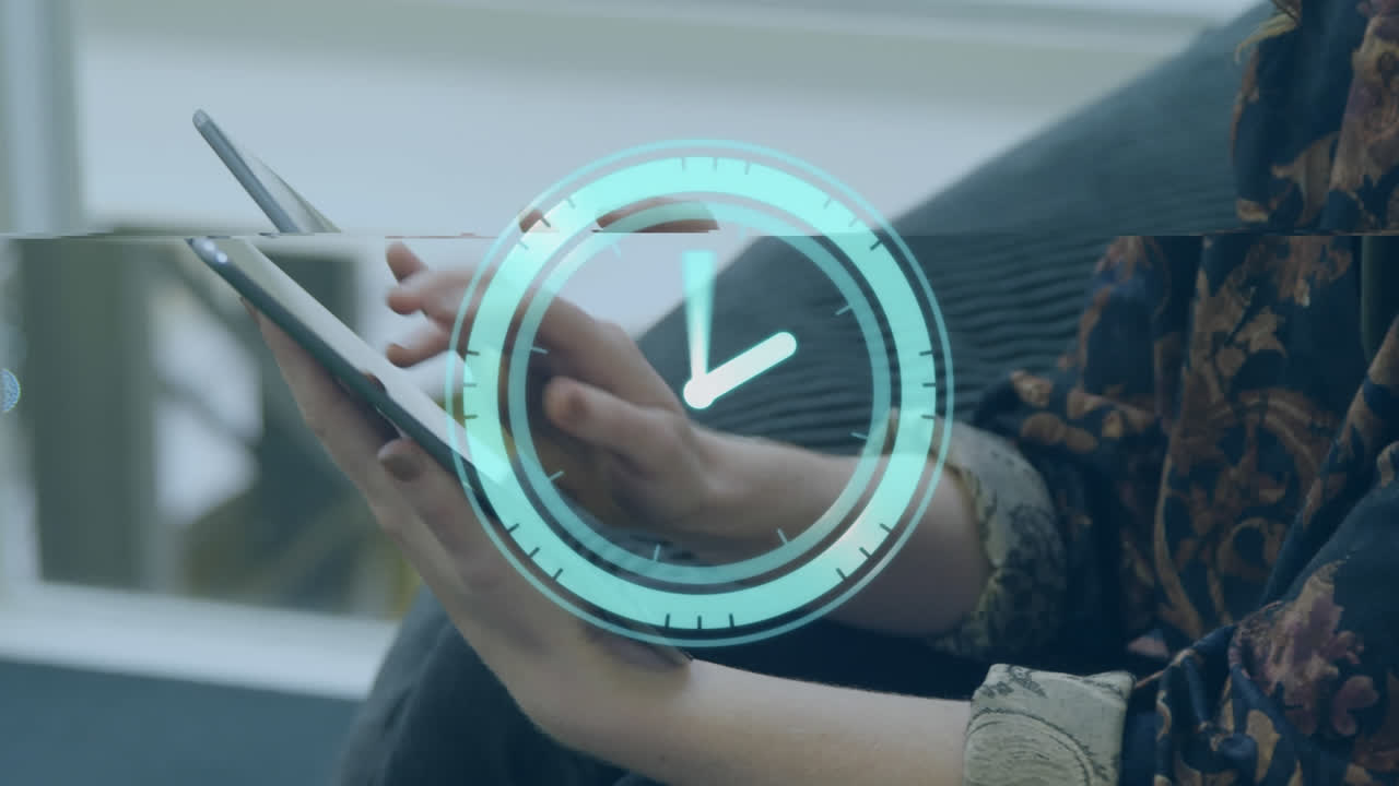 Animation of neon ticking clock over mid section of a businesswoman using digital tablet at office