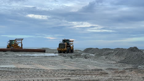 pipe for pumping sand during beach replenishment, construction equipment