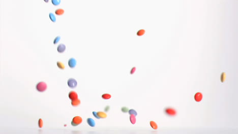 colored candies falling in super slow motion