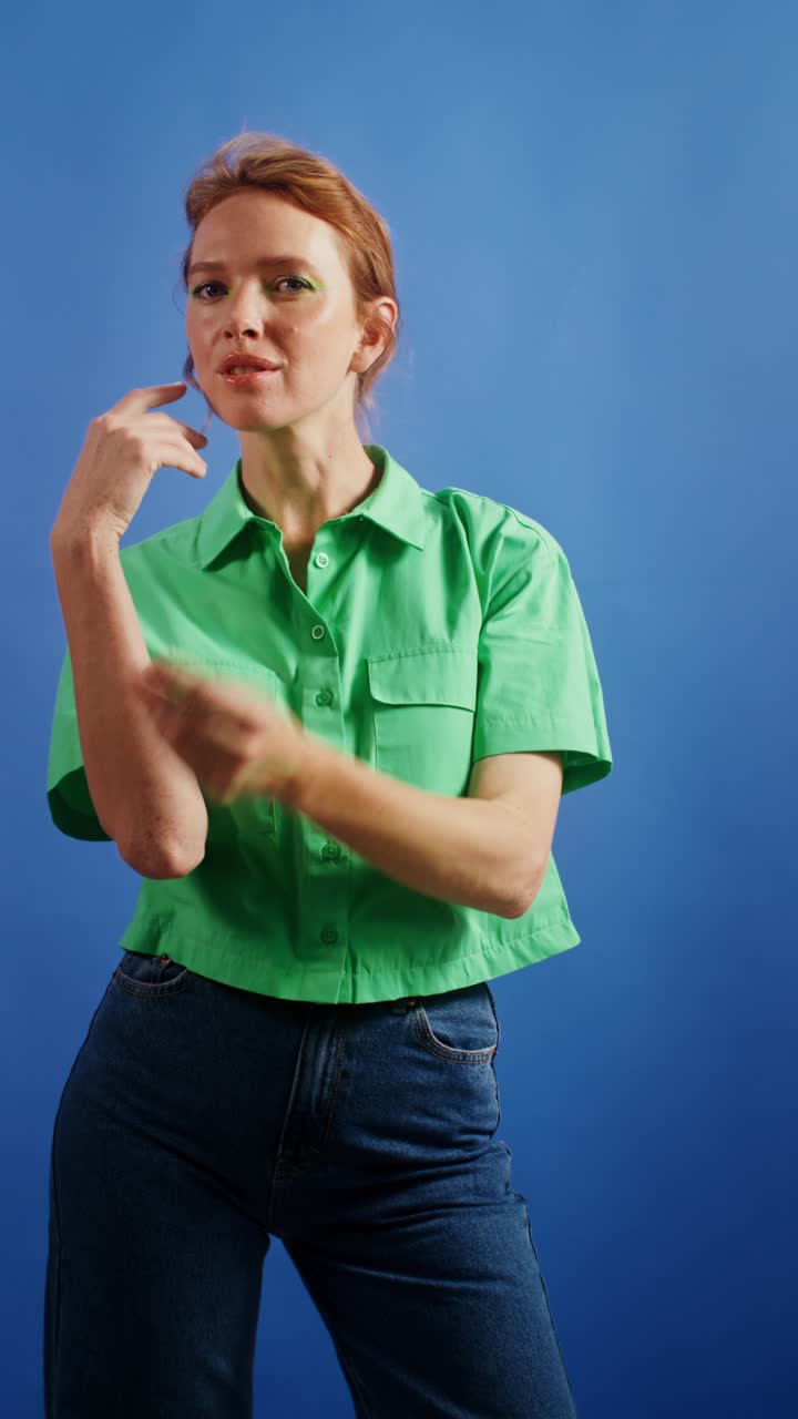 Woman in Green Shirt on Blue Background